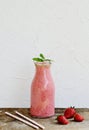 Delicious strawberry smoothie with milk, ice cream, green mint Royalty Free Stock Photo