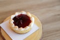 Strawberry tart pie on wooden plate. Royalty Free Stock Photo