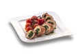 Delicious stuffed chicken roll decorated with roasted cherry tom