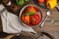 Delicious stuffed peppers served on wooden table, flat lay Royalty Free Stock Photo