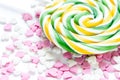 Delicious sugar lollipops on abstract candy background pattern