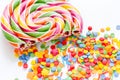 Delicious sugar lollipops on abstract candy background pattern