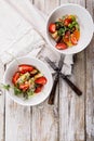 Delicious summer salad. Salad with fresh strawberries, baked beets, yellow tomatoes, dor blue cheese and herbs in a white bowl on Royalty Free Stock Photo