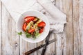 Delicious summer salad. Salad with fresh strawberries, baked beets, yellow tomatoes, dor blue cheese and herbs in a white bowl on Royalty Free Stock Photo