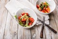 Delicious summer salad. Salad with fresh strawberries, baked beets, yellow tomatoes, dor blue cheese and herbs in a white bowl on Royalty Free Stock Photo