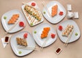 Delicious sushi on different plates on the table Royalty Free Stock Photo