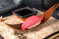 Delicious Sushi Maguro Tuna .Nigiri with Tuna. Dish decorated with a sprig of cherry blossoms. Royalty Free Stock Photo