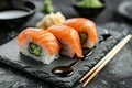 Delicious sushi platter in traditional japanese style on elegant grey table with glamourous lighting Royalty Free Stock Photo