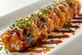 Delicious Sushi Roll Plated Elegantly with Teriyaki Sauce and Sesame Seeds, Traditional Japanese Cuisine for Gourmet Seafood