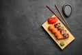 Delicious sushi rolls on dark grey table, flat lay. Space for text Royalty Free Stock Photo