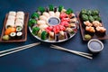 Delicious sushi set with wide assortment of fillings, served wit Royalty Free Stock Photo