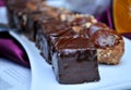 Delicious sweet black and white cake at a wedding with a purple background Royalty Free Stock Photo