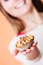 Delicious sweet cupcake in human hand. Gluttony Royalty Free Stock Photo