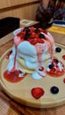 Fluffy pancake with berry sauce