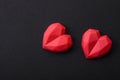 Delicious sweet heart shaped chocolate candies on a dark concrete background