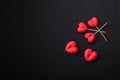 Delicious sweet heart shaped chocolate candies on a dark concrete background