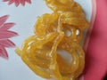 This is a delicious sweet jilebi, with yellow color,in the village of Ambegaon , Maharashtra, India.