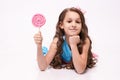 Delicious sweetness. Little girl. Multicolored lollipops Royalty Free Stock Photo