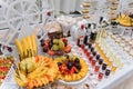 Delicious sweets on wedding candy buffet with desserts, cupcakes,tiramisu and cookies