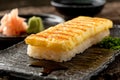 Delicious Tamagoyaki Japanese Omelette Served on Slate Plate with Wasabi and Pickled Ginger Royalty Free Stock Photo