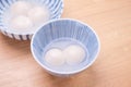 Delicious tang yuan, yuanxiao in a small bowl. Traditional festive food rice dumplings ball with stuffed fillings for Chinese