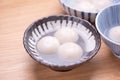 Delicious tang yuan, yuanxiao in a small bowl. Traditional festive food rice dumplings ball with stuffed fillings for Chinese