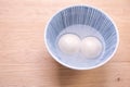 Delicious tang yuan, yuanxiao in a small bowl. Traditional festive food rice dumplings ball with stuffed fillings for Chinese