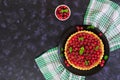 Delicious tart with custard and raspberry on dark background Royalty Free Stock Photo