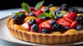 Delicious tart with fresh berries and mint on a white plate.