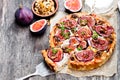 Delicious tart with fresh figs and goat cheese on rustic wooden Royalty Free Stock Photo