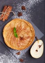 Delicious tart with pears, cinnamon and sugar powder