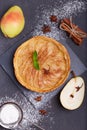 Delicious tart with pears, cinnamon and sugar powder