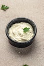 Delicious tartar, garlic mayonnaise sauce on a light background. vertical image. top view. place for text