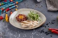 Delicious tartare with toasted bread and sprouted wheat on a plate. Healthy lunch meal made of raw meat. Classical