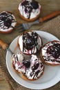 Delicious tartlets with cream cheese, chocolate and cherries. Royalty Free Stock Photo