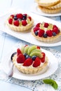 Delicious tartlets with fruit and cream mascaropne