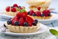 Delicious tartlets with fruit and cream mascaropne