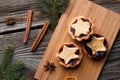 Delicious tarts with jam on wooden board