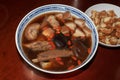 Home made delicious and tasty Bah Kut Teh pork rib soup served with stir ice salad and fried onion plus fired bread.