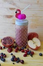 Smoothie with blueberries, cranberries, apple and pomegranate