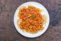 Delicious tasty yummy spaghetti with minced pork tomato sauce and green rosemary in white plate Royalty Free Stock Photo