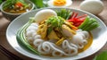 Delicious Thai Curry Noodle Dish with Chicken and Egg Royalty Free Stock Photo