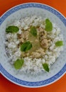 Thai green chicken curry with white rice and mint leaves