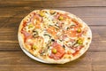 Delicious thin crust pizza with mushrooms, lots of melted cheese, flaked Parmesan Royalty Free Stock Photo
