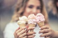Delicious three ice cream in female hands - close-up Royalty Free Stock Photo