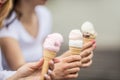 Delicious three ice cream in female hands - close-up Royalty Free Stock Photo