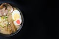 Delicious tonkotsu ramen, Japanese noodle in pork Bone based soup topped with chashu pork, boiled egg, pickled bamboo shoot