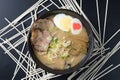 Delicious tonkotsu ramen, Japanese noodle in pork Bone based soup topped with chashu pork, boiled egg, pickled bamboo shoot