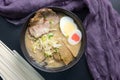 Delicious tonkotsu ramen, Japanese noodle in pork Bone based soup topped with chashu pork, boiled egg, pickled bamboo shoot