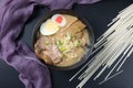 Delicious tonkotsu ramen, Japanese noodle in pork Bone based soup topped with chashu pork, boiled egg, pickled bamboo shoot